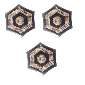 May include: Three black hexagonal resin ornaments with a gold-colored design. Each ornament has a smaller hexagon in the center with a textured surface.