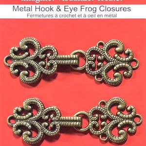 May include: Two antique gold metal hook and eye closures with ornate designs.  Sew Trendz imagine! visualize! create! Metal Hook & Eye Frog Closures Fermetures à crochet et à oeil en métal