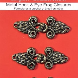 May include: Three antique gold metal hook and eye closures with a decorative design. The closures are for sewing and crafting projects.
