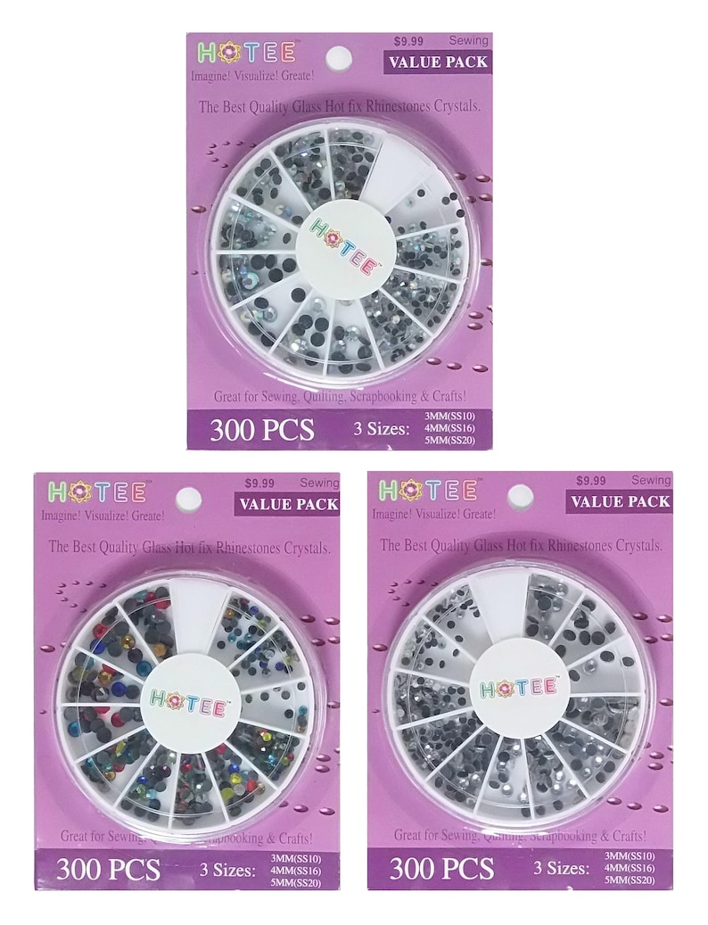 May include: Three purple packaging cards each containing a circular white plastic organizer filled with assorted glass hot fix rhinestones. The text on the cards reads HOTEE, Sewing Value Pack, 300 PCS, and lists three sizes: 3mm, 4mm, and 5mm.