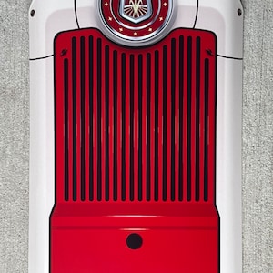 May include: A white and red metal sign featuring a Ford logo and a red grille. The sign is in a vintage style with a white background, a red grille and a Ford logo in the centre.