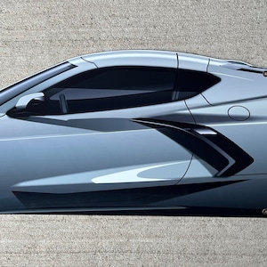 May include: A banner featuring a silver sports car door with black tinted windows. The car door has a sleek, modern design with sharp angles and a dark accent. The banner has grommets for hanging.