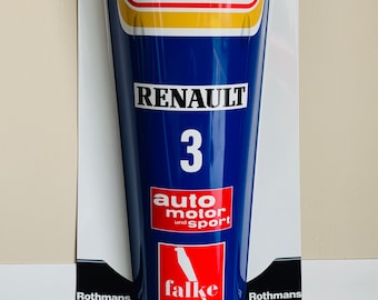 May include: A blue and white metal sign with the words "Rothmans", "Renault", "3", "auto motor und sport", "falke", "Castrol", and "Good Year" printed on it.