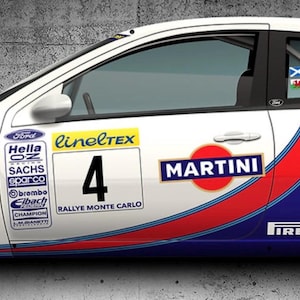 May include: White car door with racing decals, including "MARTINI" and "PIRELLI" logos. Features the number 4 and sponsor logos. Red, blue, and white stripes accent the door. The door is set against a grey concrete wall.