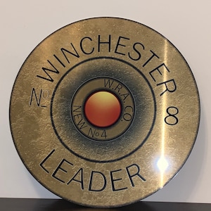 Dekoracja ścienna w stylu retro z motywem kuli myśliwskiej Winchester Leader