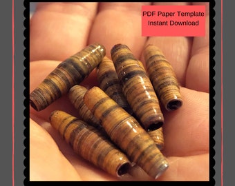 May include: A close-up of a hand holding several brown and gold paper beads. The beads are made of rolled paper and have a striped pattern. The image includes the text "PDF Paper Template Instant Download".