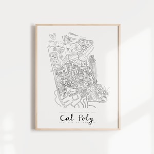 May include: A black and white line drawing print of the Cal Poly San Luis Obispo campus map. The print is framed in a light wood frame and is hanging on a white wall.