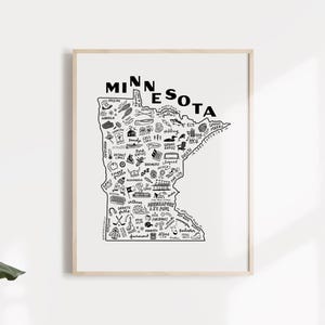May include: A black and white line drawing of the state of Minnesota with various cities and landmarks labeled. The drawing includes icons representing activities and attractions in each city, such as fishing, skiing, and hiking.