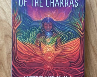 Infinite Wisdom of the Chakras oracle deck. Art by Dhira Lawrence Written by Alison DeNicola