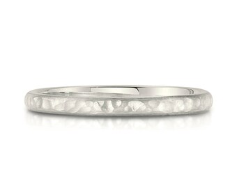 May include: A simple silver wedding band with a hammered texture.