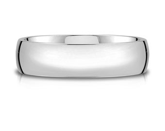May include: A highly polished silver ring with a smooth, rounded band. The ring's surface reflects light, giving it a bright, shiny appearance. A classic design suitable for various occasions.