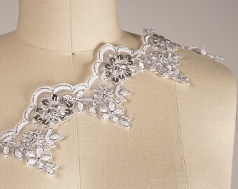 Pizzo da sposa bianco: foglia con paillettes argento, bordo smerlato