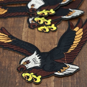 Eagle Patch. Iron on Ferocious Eagle Patch with With White Embroidered head/ Brown Underwings and Black Body and Yellow Claws