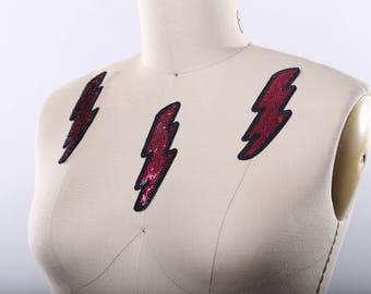 Toppa con fulmine in paillettes magenta - Applicazione termoadesiva