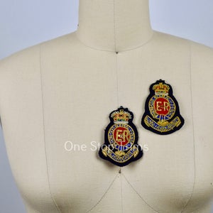 May include: Two embroidered patches with a gold crown, gold lettering, and a red and blue design. The patches feature the letters "ER" and the text "The Queen's Royal Regiment".