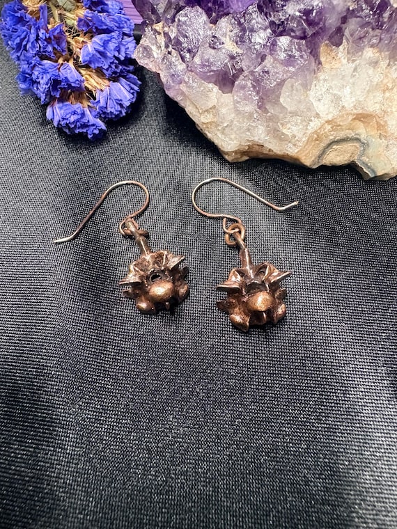 Real ethically-sourced python bones electroformed in copper — wearable curiosity cabinet vibes that no mass manufacturer is replicating.