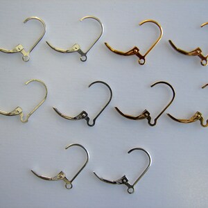 May include: A set of 10 earring hooks, with 4 silver, 4 gold, and 2 silver hooks. The hooks are all the same size and shape, with a small loop at the top and a clasp at the bottom.