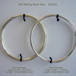 May include: Two coiled spools of 925 sterling silver wire, secured with black ties. The text indicates wire thickness and length: 20 ga 0.032" (0.81mm), 10 feet; 18 ga 0.040" (1.02mm), 6 feet. The wire is labeled as "SOLID".