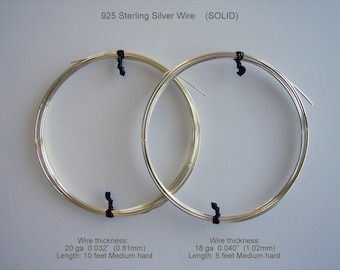 May include: Two coiled spools of 925 sterling silver wire, secured with black ties. The text indicates wire thickness and length: 20 ga 0.81mm, 3.05 metres; 18 ga 1.02mm, 1.83 metres. The wire is labeled as "SOLID".