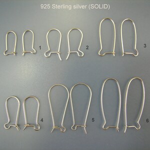 May include: Six pairs of sterling silver earring hooks in various sizes. The hooks are all made of solid silver and have a smooth, polished finish. The hooks are numbered 1 through 6, with the smallest hook being number 1 and the largest hook being number 6.
