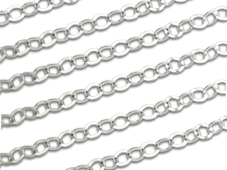 May include: Silver chain with oval links. The chain is flat and has a shiny finish.