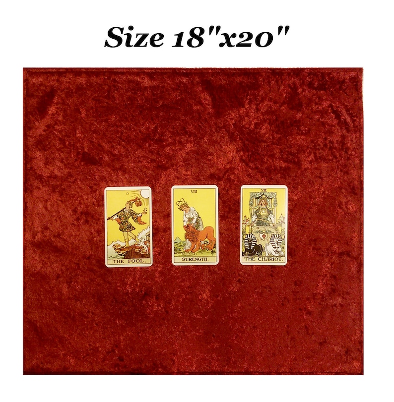 May include: A red velvet tarot cloth measuring 18 inches by 20 inches. Three tarot cards are laid out on the cloth: The Fool, Strength, and The Chariot.