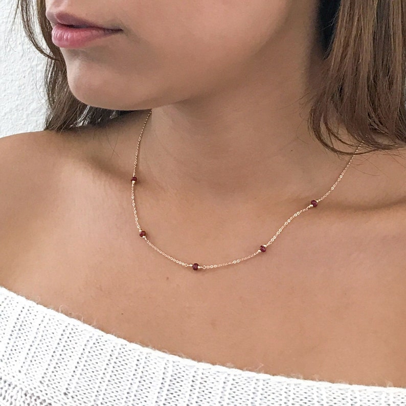 Ruby station necklace shown with the 5 ruby option.  Available in 14k gold filled or sterling silver chain