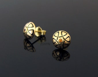 Yellow gold stud earrings with black enamel and orange sapphires