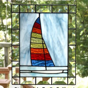 Custom Sailboat stained glass panel with multi colored sail and bevels
