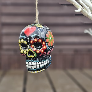 Mexican day of the Dead ceramic hanging sugar skull. Sugar skull bauble. Hand painted skull. Hanging skull decoration. Halloween decoration.