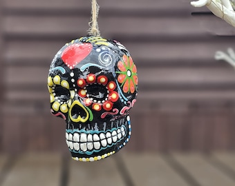 Mexican day of the Dead ceramic hanging sugar skull. Sugar skull bauble. Hand painted skull. Hanging skull decoration. Halloween decoration.