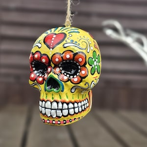 Mexican day of the Dead ceramic hanging sugar skull. Sugar skull bauble. Hand painted skull. Hanging skull decoration. Halloween decoration.