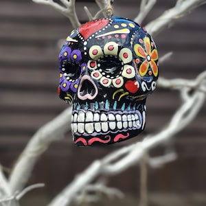 Mexican day of the Dead ceramic hanging sugar skull. Sugar skull bauble. Hand painted skull. Hanging skull decoration. Halloween decoration.