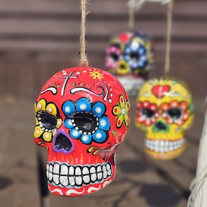 Mexican day of the Dead ceramic hanging sugar skull. Sugar skull bauble. Hand painted skull. Hanging skull decoration. Halloween decoration.