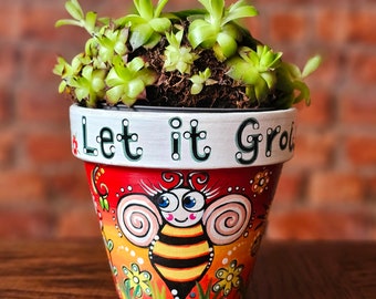 メキシコの死者の日をモチーフにしたテラコッタ植木鉢。シュガー