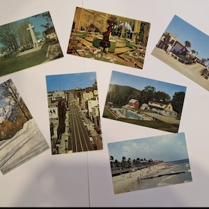 7 unused vintage postcards! Mailed to you. Not digital.