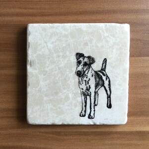 May include: Square, off-white marble coaster featuring a black and white illustration of a dog. The dog is standing, with its tail up and ears perked. The coaster has a natural, veined pattern.