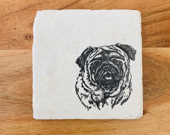 May include: A white square coaster with a black and white illustration of a pug dog's face.
