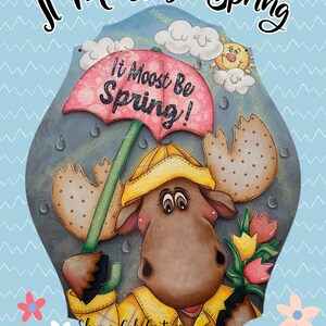 May include: A wooden sign with a moose holding an umbrella and a bouquet of tulips. The sign says "It Moost Be Spring!" and is decorated with clouds, raindrops, and a sun. The sign is painted in brown, yellow, pink, and green.