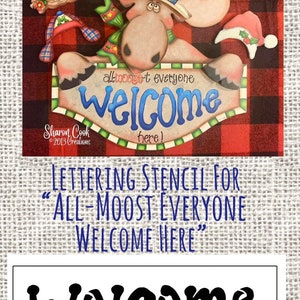 May include: A stencil for a welcome sign featuring a moose wearing a red, white, and blue hat. The sign says "all-mooset everyone welcome here!"