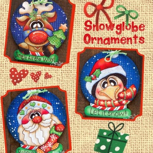 May include: Three hand-painted Christmas ornaments in the shape of snow globes. The first ornament features a reindeer with a red nose and a green tree. The second ornament features a penguin wearing a red hat and a scarf. The third ornament features Santa Claus with a white beard and a green hat. Each ornament has a blue background with white snowflakes and the text "Jingle All the Way", "Let it Snow", and "Believe!" respectively.