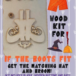 May include: A Halloween-themed wood kit with a light brown plaque featuring wooden boots, bats, and buttons. The kit includes fabric, embroidery floss, and a triangle hanger. Text reads "If the boots fit, get the matching hat and broom!"