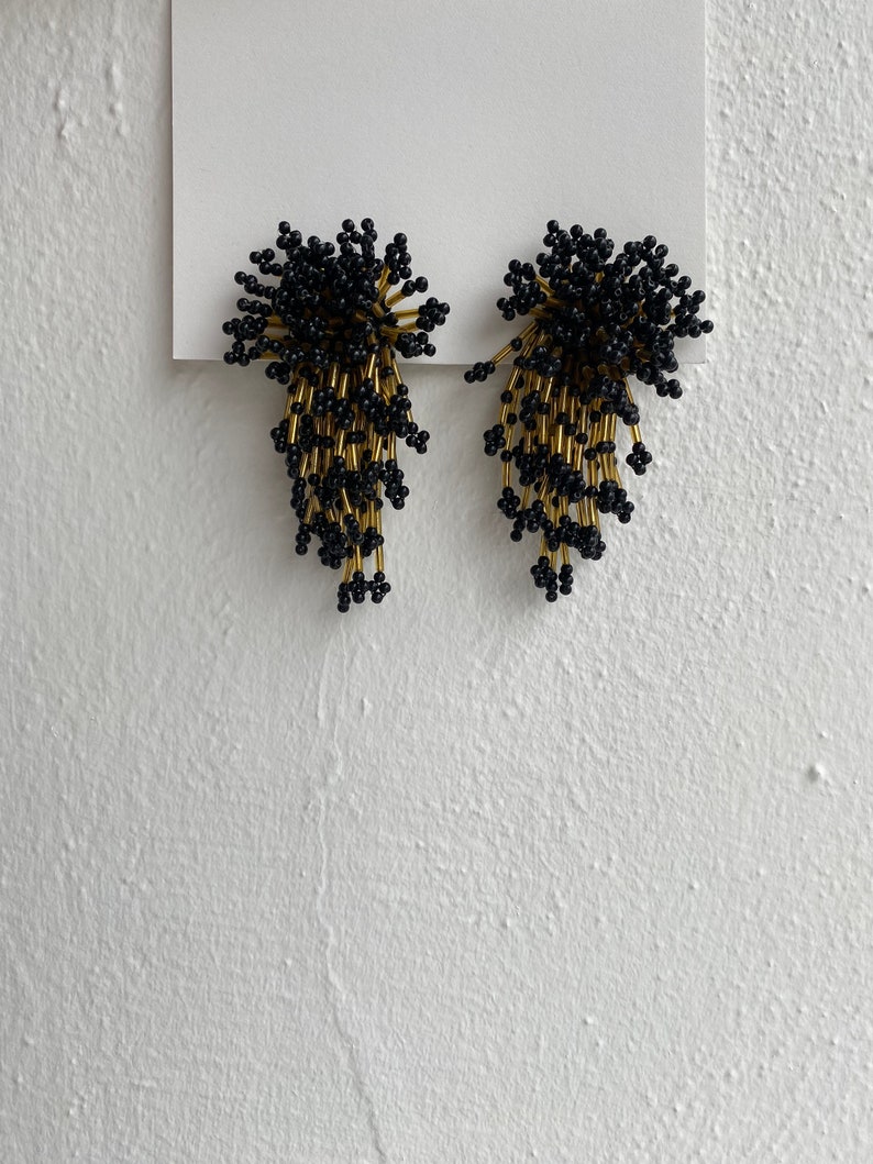 vintage black and gold beaded starburst clip on earrings image 1