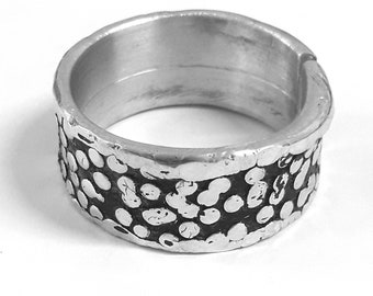 Aluminum ring band, with texture of small round dots, hammered edge and personalized text