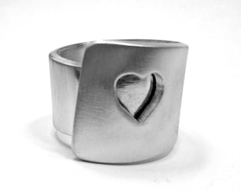 With personalized text, band aluminum ring, with perforated heart and satin finish.