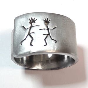 Personalized text. Open aluminum band ring with: He dances with him, and custom text.