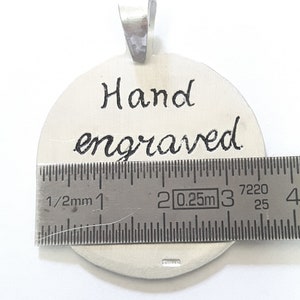 Aluminum pendant medal with a dog paw print and human footprint, with personalized text on the back. image 3