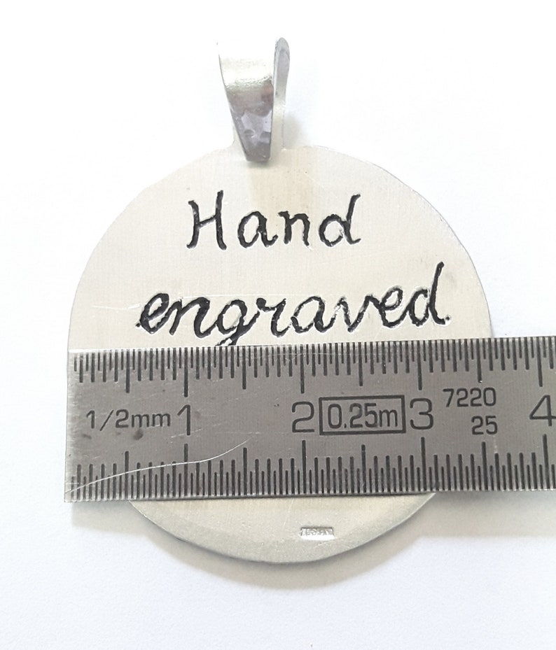 Aluminum pendant medal with a dog paw print and human footprint, with personalized text on the back. image 3