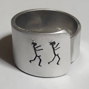 Personalized text. Open aluminum band ring with: He follows him.