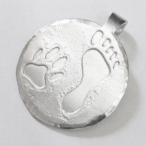 Aluminum pendant medal with a dog paw print and human footprint, with personalized text on the back. image 2